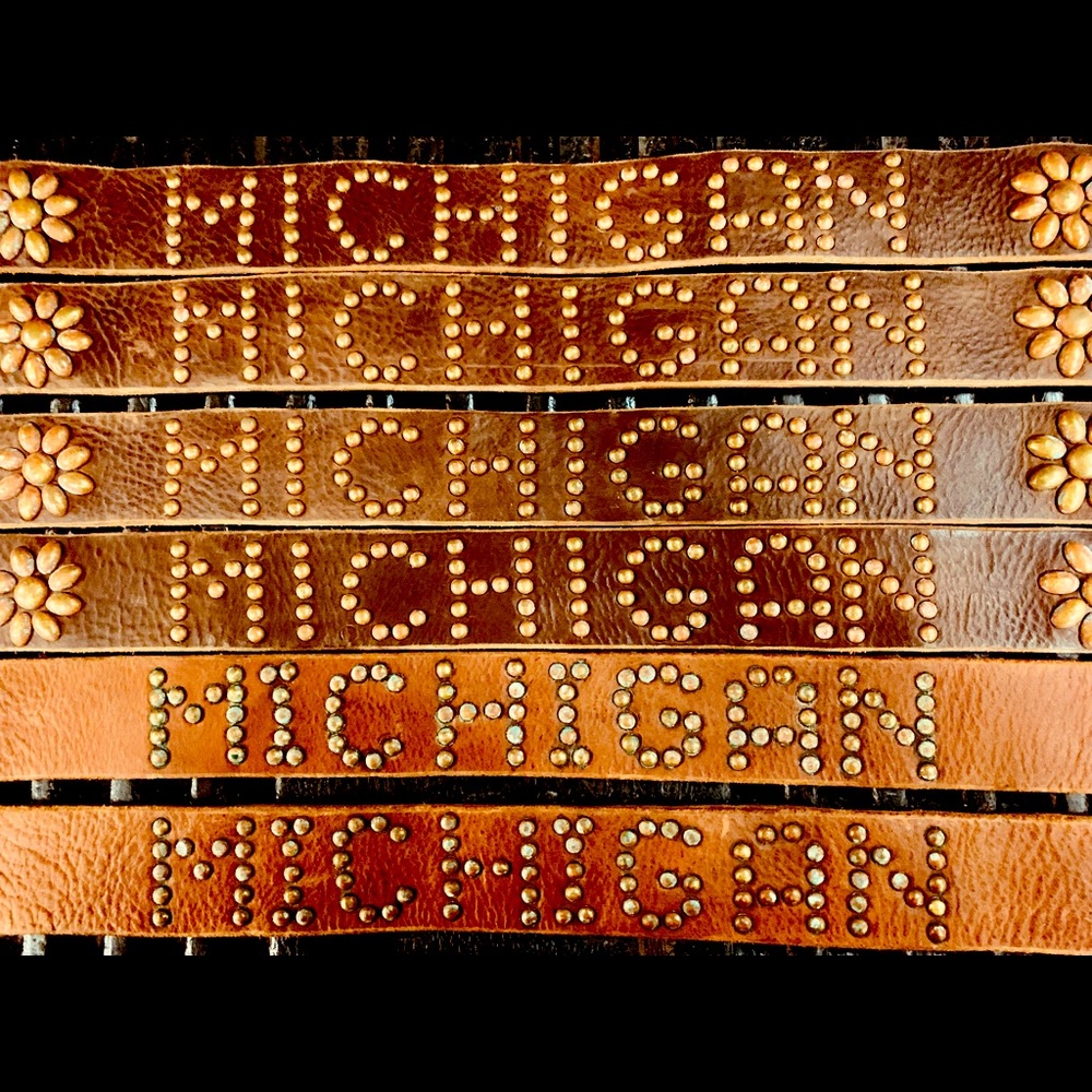 Vegetable tanned leather with hand distressed/corroded studs.